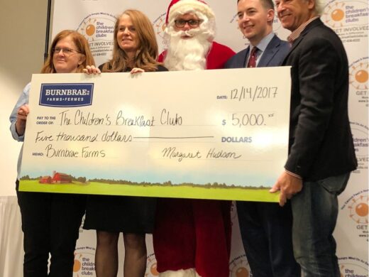 Representatives from Burnbrae Farms handing donation check to The Children's Breakfast Club officials