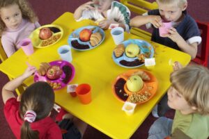 Children having breakfast together