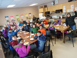 Children eating a meal on a table